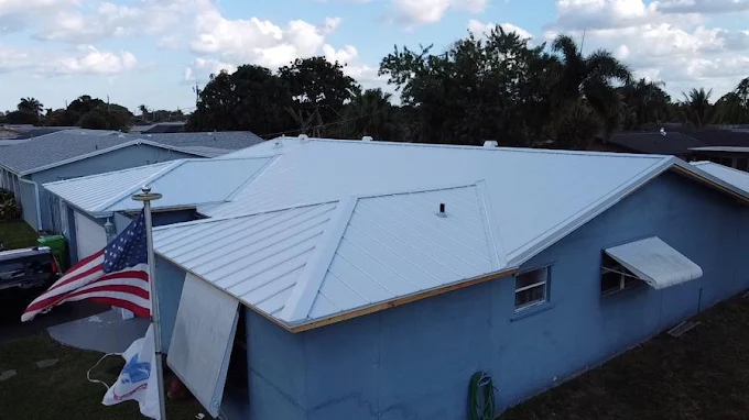 Residential property with a newly installed light-coloured metal roof